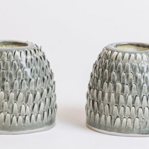 green spiked candlesticks